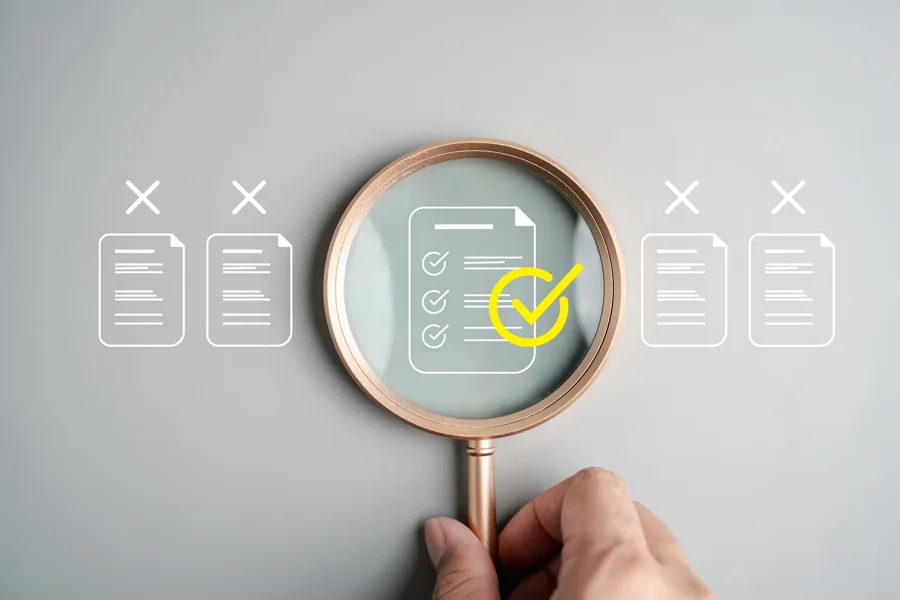 Magnifying glass highlighting a completed document review